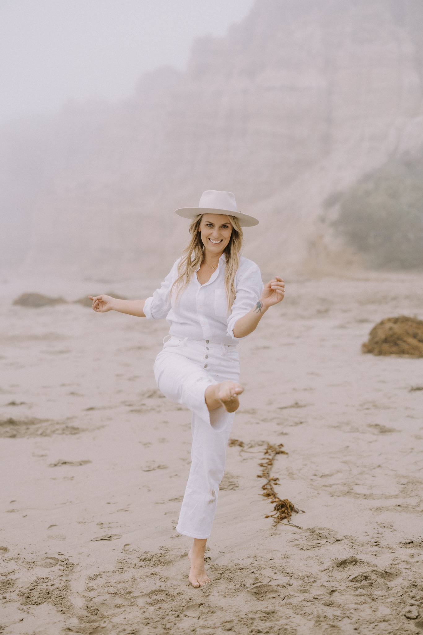 Kali May walking on the beach